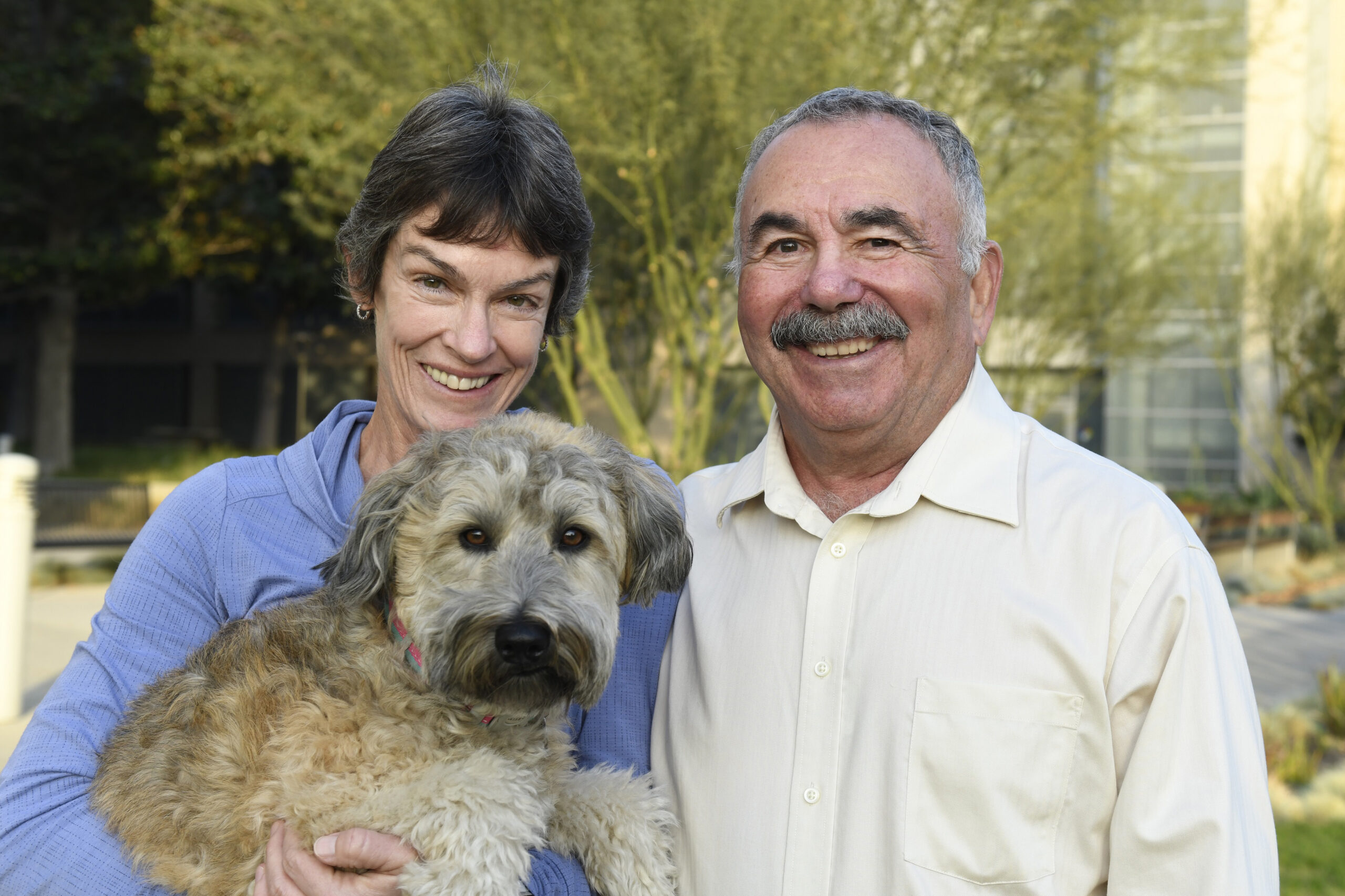 Chuck and Eileen O’Shea, Legacy of Hope Society member, with their dog.